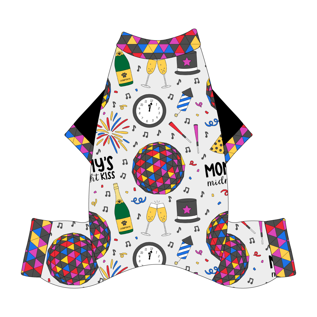 Comfy New Years Pajamas with solid black sleeves in a dog friendly pattern that shows a multi-colored New Years ball, the words Mommy's Midnight Kiss, a clock, champagne bottle and champagne toast, fireworks, confetti and more on a white background. It's complete with NYE Ball trim on the neck, sleeves and legs.