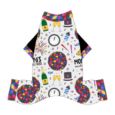 Comfy New Years Pajamas with solid black sleeves in a dog friendly pattern that shows a multi-colored New Years ball, the words Mommy's Midnight Kiss, a clock, champagne bottle and champagne toast, fireworks, confetti and more on a white background. It's complete with NYE Ball trim on the neck, sleeves and legs.