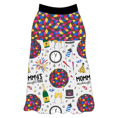 Tank style in a dog friendly pattern that shows a multi-colored New Years ball, the words Mommy's Midnight Kiss, a clock, champagne bottle and champagne toast, fireworks, confetti and more on a white background. It's complete with NYE Ball on the upper back and gathering at the yoke. Black trim is on the neck and shoulders.