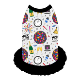 Dress style tank with a girly ruffle skirt in a dog friendly pattern that shows a multi-colored New Years ball, the words Mommy's Midnight Kiss, a clock, champagne bottle and champagne toast, fireworks, confetti and more on a white background. It's complete with black trim on the neck, shoulders and ruffles.