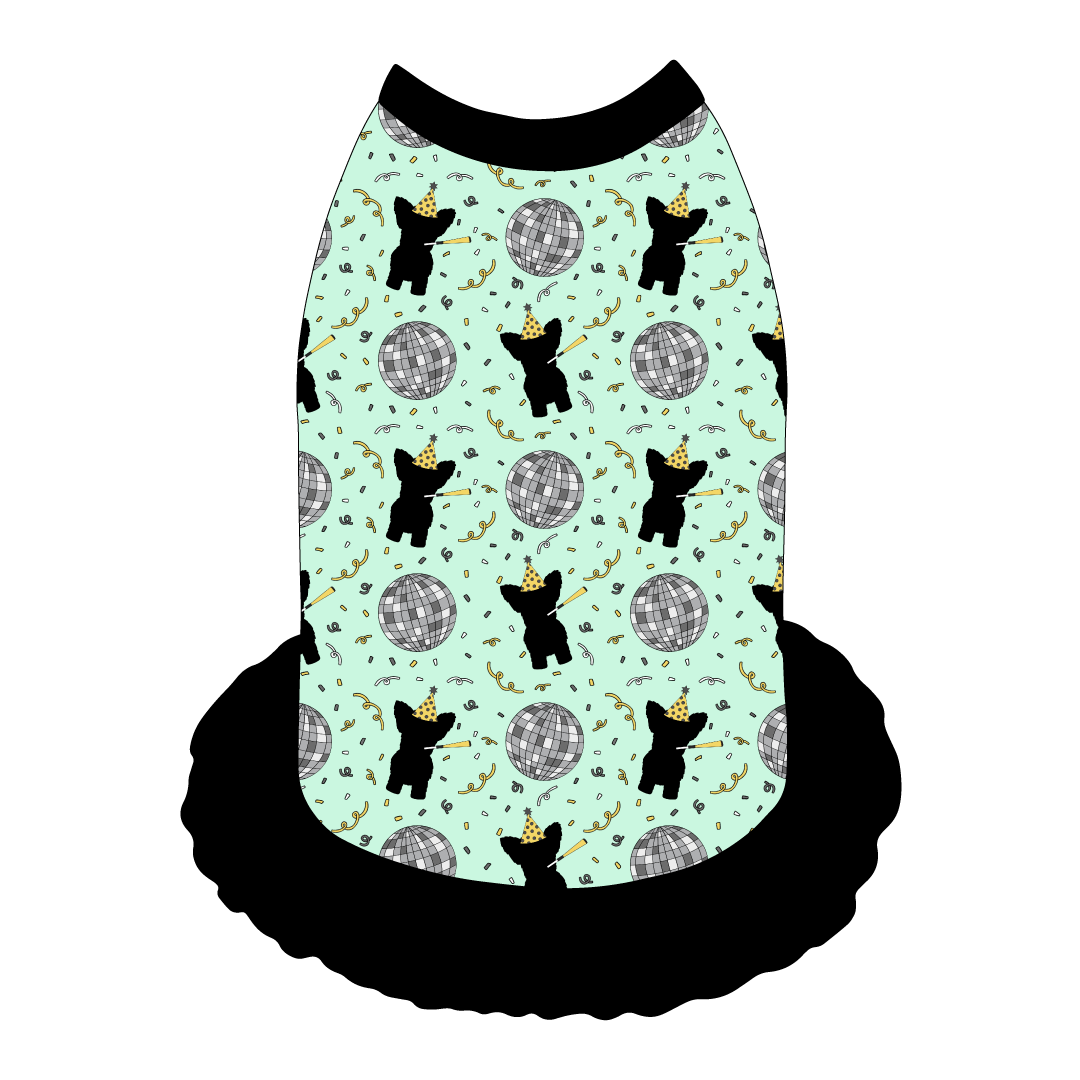 Dress style tank with a girly ruffle skirt in a dog friendly pattern that shows a mirror ball, dog with a party blower and confetti on a light green background. It's complete with black trim on the neck, shoulders and ruffles.