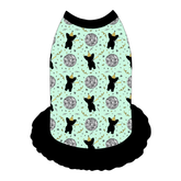 Dress style tank with a girly ruffle skirt in a dog friendly pattern that shows a mirror ball, dog with a party blower and confetti on a light green background. It's complete with black trim on the neck, shoulders and ruffles.