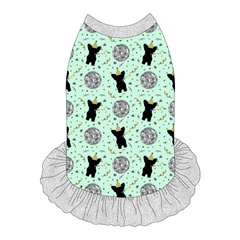 Dress style tank with a girly ruffle skirt in a dog friendly pattern that shows a mirror ball, dog with a party blower and confetti on a light green background. It's complete with silver trim on the neck, shoulders and ruffles.
