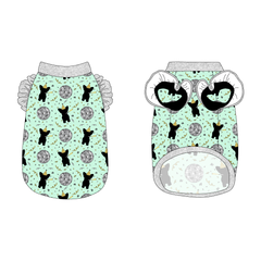 Tank with ruffle accents on the shoulders in a dog friendly pattern that shows a mirror ball, dog with a party blower and confetti on a light green background. It's complete with silver sparkle trim on the neck, waist and shoulder ruffles, as well as a coordinating trim under the shoulder ruffles in black.