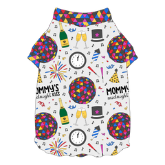 Tee shirt with flutter hem in a dog friendly pattern that shows a multi-colored New Years ball, the words Mommy's Midnight Kiss, a clock, champagne bottle and champagne toast, fireworks, confetti and more on a white background. It's complete with NYE Ball trim on the neck and sleeves.