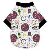 Tee shirt in a dog friendly pattern that shows a multi-colored New Years ball, the words Mommy's Midnight Kiss, a clock, champagne bottle and champagne toast, fireworks, confetti and more on a white background. It's complete with black trim on the neck, waist and sleeves