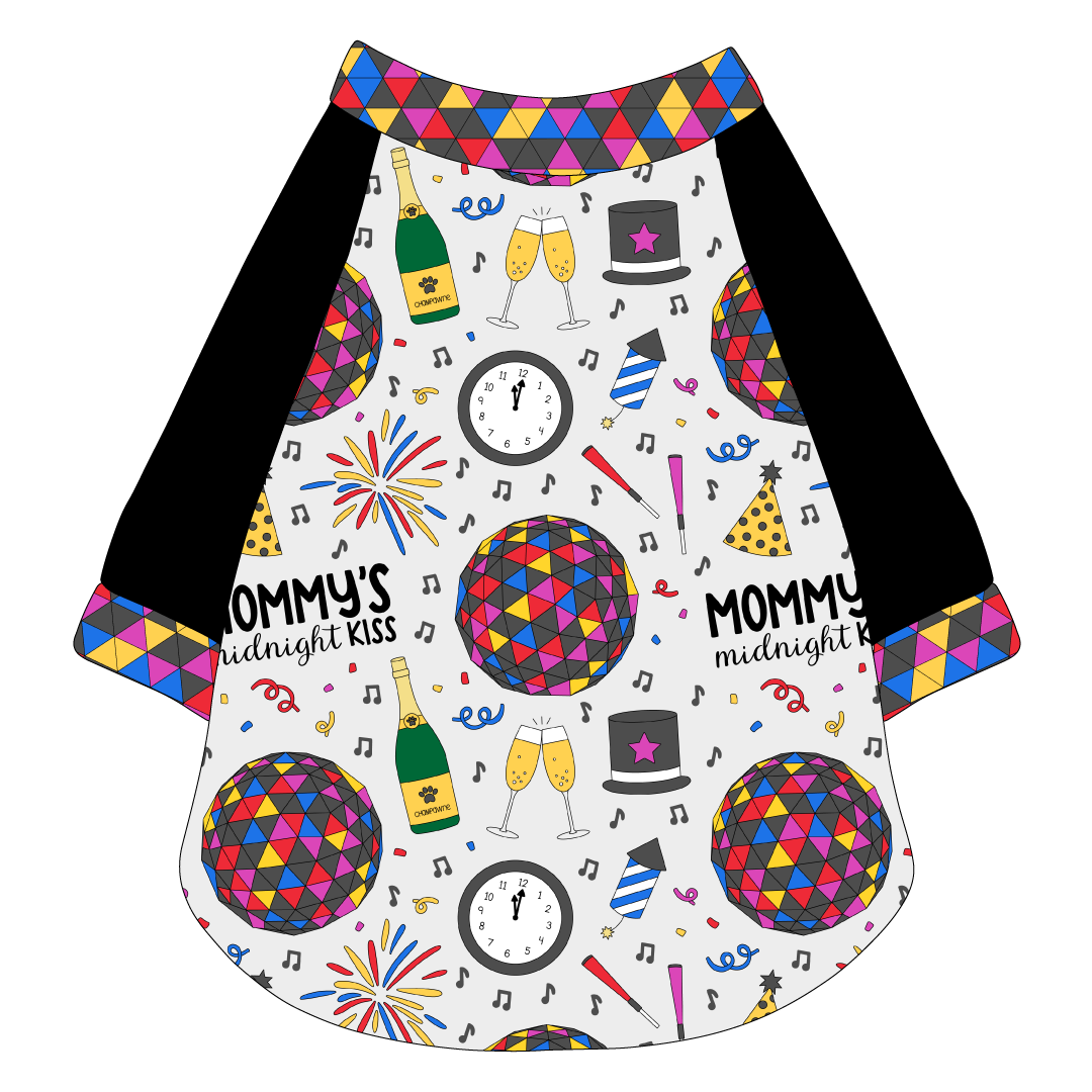Raglan style tee in a dog friendly pattern that shows a multi-colored New Years ball, the words Mommy's Midnight Kiss, a clock, champagne bottle and champagne toast, fireworks, confetti and more on a white background. It's complete with black sleeves and trimmed in NYE Ball. NYE Ball trim is also on the neck and waist.