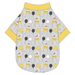 Tee shirt in a dog friendly pattern that shows two happy champagne glasses making a toast with hearts overhead, gold star balloons and traditional balloons in white and gray on a silver sparkle background. It's complete with gold trim on the neck, waist and sleeves