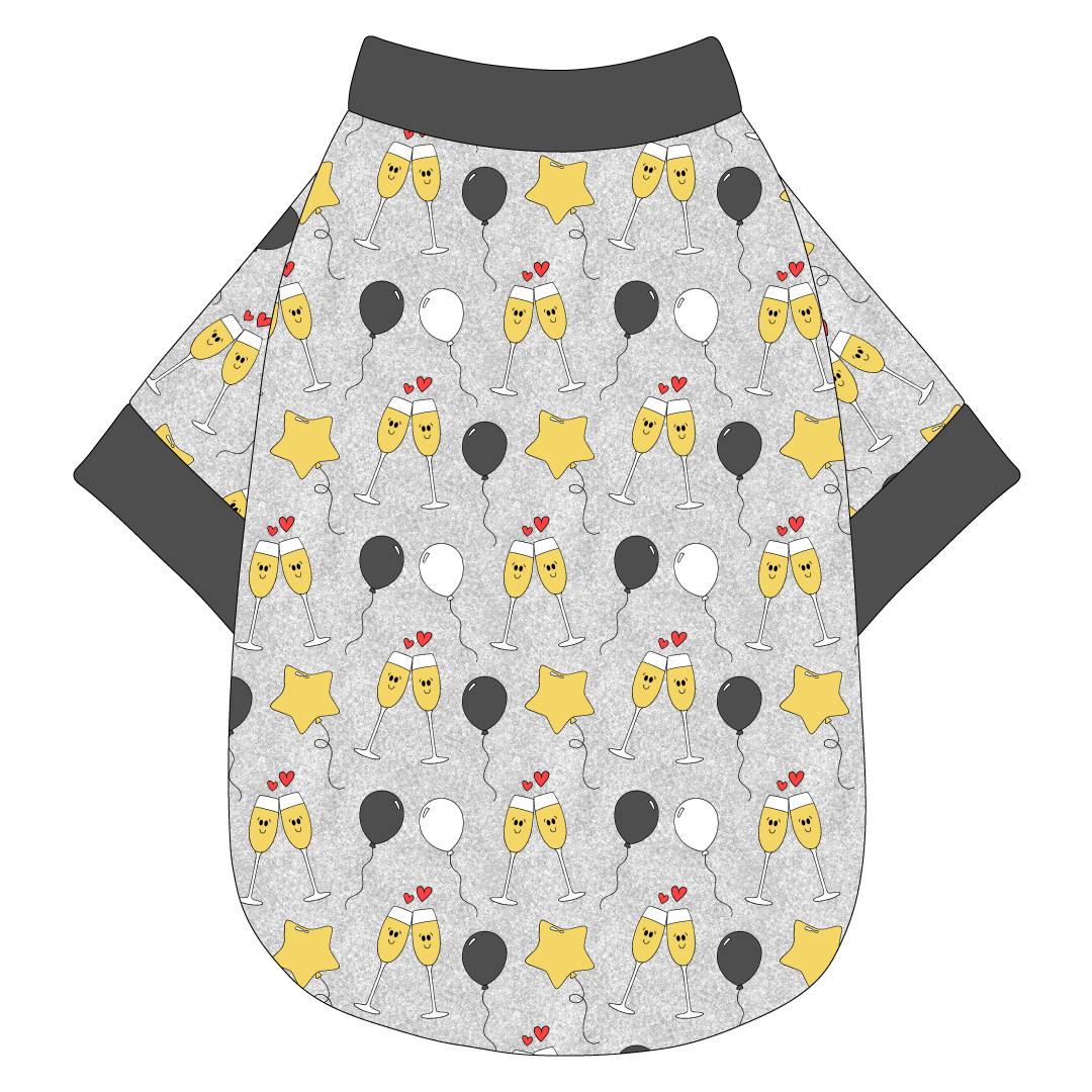 Tee shirt in a dog friendly pattern that shows two happy champagne glasses making a toast with hearts overhead, gold star balloons and traditional balloons in white and gray on a silver sparkle background. It's complete with gray trim on the neck, waist and sleeves