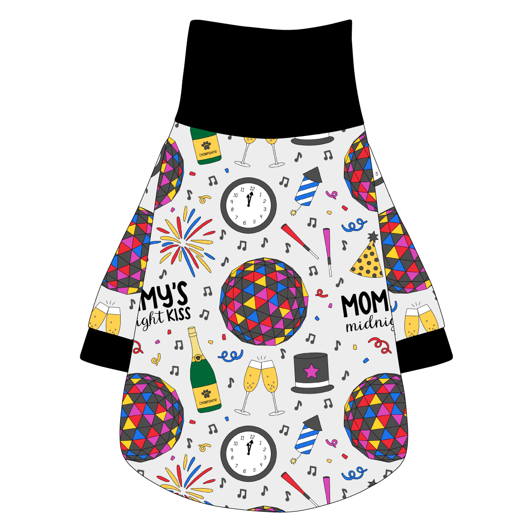 Tee shirt with turtleneck in a dog friendly pattern that shows a multi-colored New Years ball, the words Mommy's Midnight Kiss, a clock, champagne bottle and champagne toast, fireworks, confetti and more on a white background. It's complete with black trim on the neck, waist and sleeves.