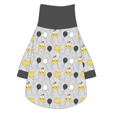 Tee shirt with turtleneck in a dog friendly pattern that shows two happy champagne glasses making a toast with hearts overhead, gold star balloons and traditional balloons in white and gray on a silver sparkle background. It's complete with gray trim on the neck, waist and sleeves.