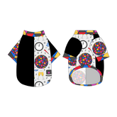 Split back tee shirt using two coordinating fabrics: one side in solid black and one side in a dog friendly pattern that shows a multi-colored New Years ball, the words Mommy's Midnight Kiss, a clock, champagne bottle and champagne toast, fireworks, confetti and more on a white background. It's complete with NYE Ball trim on the neck, sleeves and waist.