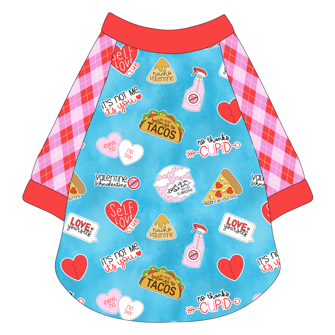 Raglan style tee in a dog friendly pattern that shows witty anti-Valentine phrases and fun images. It's complete with Valentine argyle plaid sleeves, with solid red trim on the sleeve edges, neck and waist.
