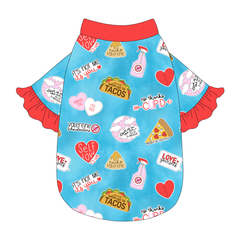 Tee style in a dog friendly pattern that shows witty anti-Valentine phrases and fun images. It's complete with solid red ruffles on the sleeve edges, as well as trim on the neck and waist.