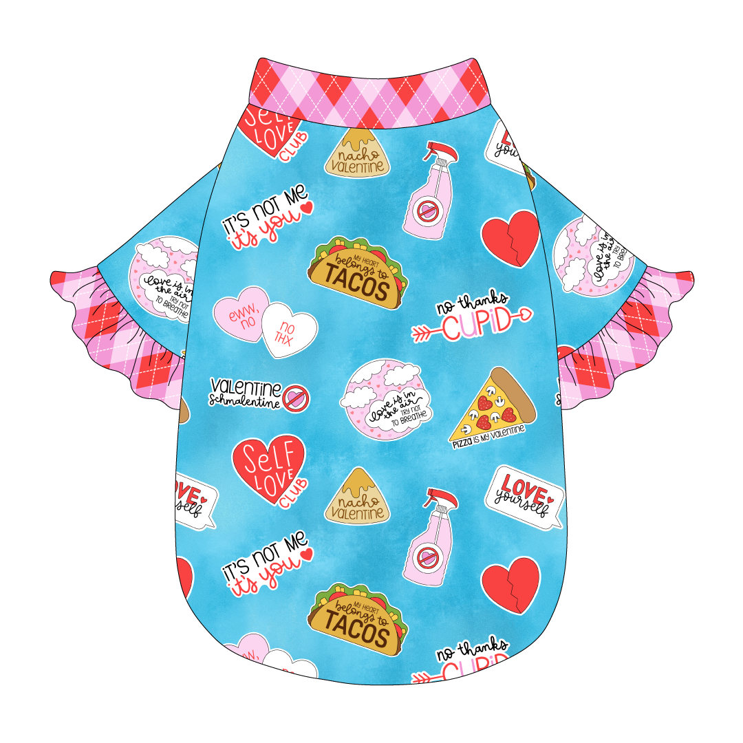 Tee style in a dog friendly pattern that shows witty anti-Valentine phrases and fun images. It's complete with solid Valentine argyle plaid ruffles on the sleeve edges, as well as trim on the neck and waist.