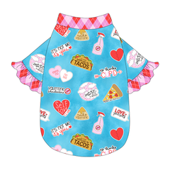 Tee style in a dog friendly pattern that shows witty anti-Valentine phrases and fun images. It's complete with solid Valentine argyle plaid ruffles on the sleeve edges, as well as trim on the neck and waist.