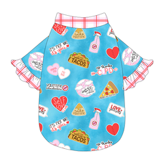 Tee style in a dog friendly pattern that shows witty anti-Valentine phrases and fun images. It's complete with solid red and pink plaid ruffles on the sleeve edges, as well as trim on the neck and waist.