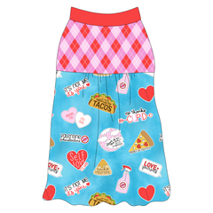 Tank style in a dog friendly pattern that shows witty anti-Valentine phrases and fun images. It's complete with Valentine argyle plaid on the upper back and gathering at the yoke. Solid red trim is on the neck and shoulders.