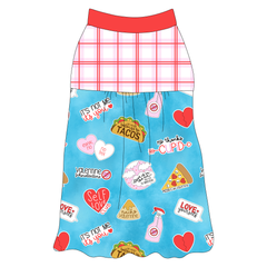 Tank style in a dog friendly pattern that shows witty anti-Valentine phrases and fun images. It's complete with red and pink plaid on the upper back and gathering at the yoke. Solid red trim is on the neck and shoulders.