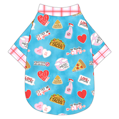 Tee shirt in a dog friendly pattern that shows witty anti-Valentine phrases and fun images. It's complete with red and pink plaid trim on the neck, waist and sleeves.