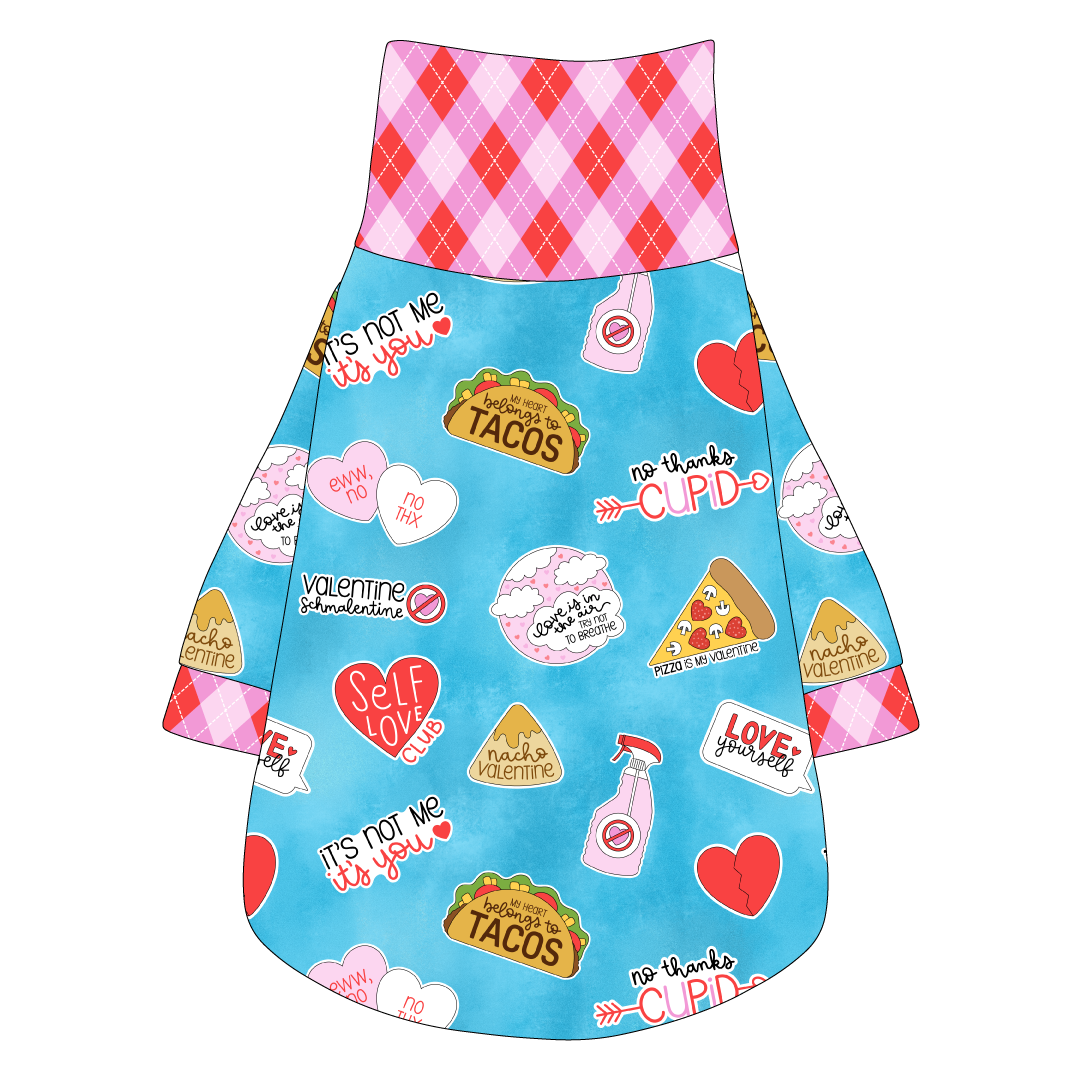 Tee shirt with turtleneck in a dog friendly pattern that shows witty anti-Valentine phrases and fun images. It's complete with Valentine argyle plaid trim on the neck, sleeves and waist.