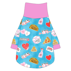 Tee shirt with turtleneck in a dog friendly pattern that shows witty anti-Valentine phrases and fun images. It's complete with solid pink trim on the neck, sleeves and waist.