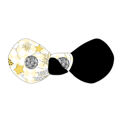 Hair bow twisted with two fabrics: one in a dog friendly pattern that shows a mirror ball, top hat, champagne toast, balloons, clock striking midnight, banner reading Happy New Year and more on a light gold and white diamond background and one side in black.