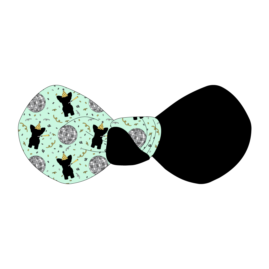 Hair bow twisted with two fabrics: one in a dog friendly pattern that shows a mirror ball, dog with a party blower and confetti on a light green background and one side in black.