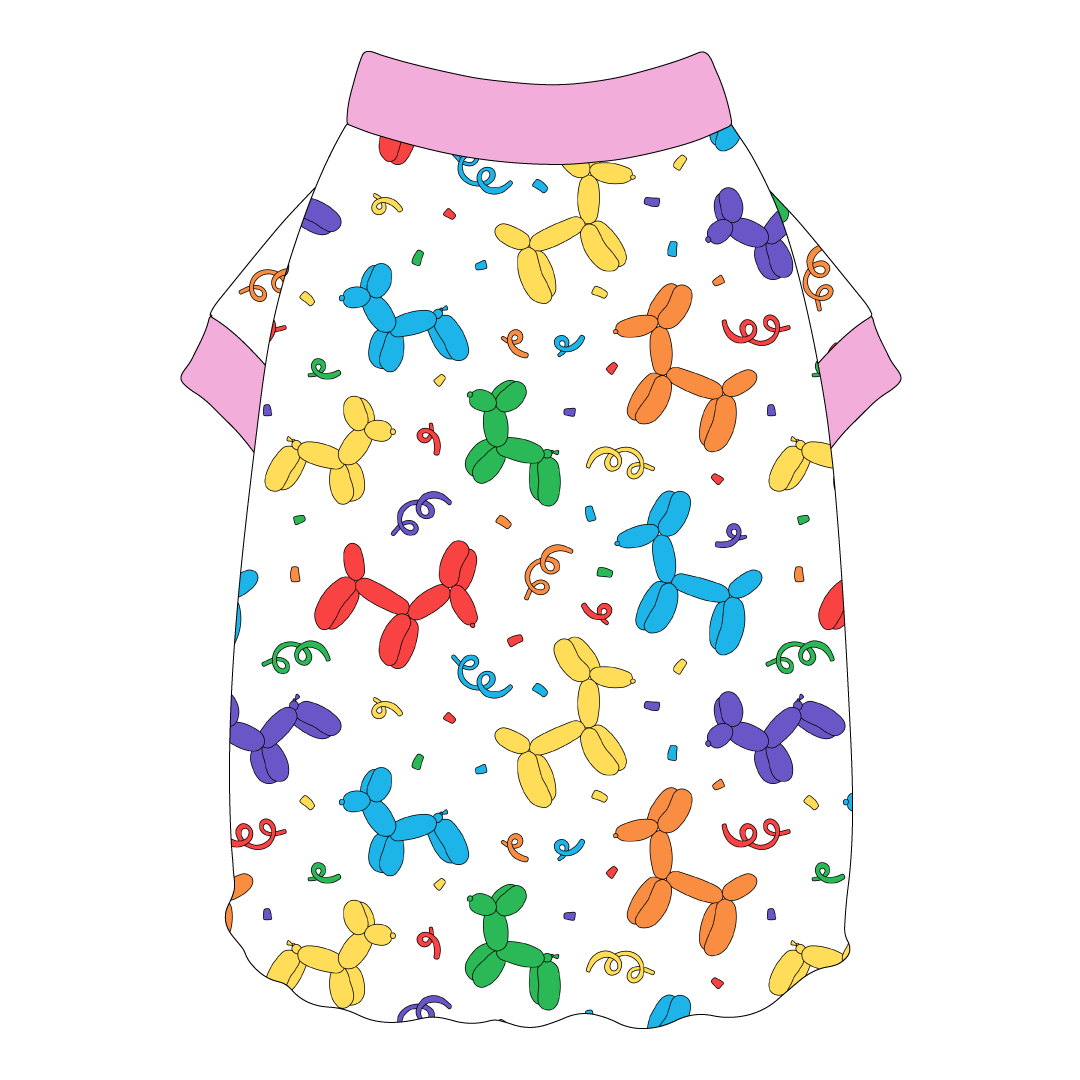 Tee shirt style with flutter hem in a dog friendly pattern that shows party images like balloons and confetti. It's complete with solid pink trim on the neck and sleeves.