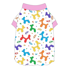 Tee shirt style with flutter hem in a dog friendly pattern that shows party images like balloons and confetti. It's complete with solid pink trim on the neck and sleeves.