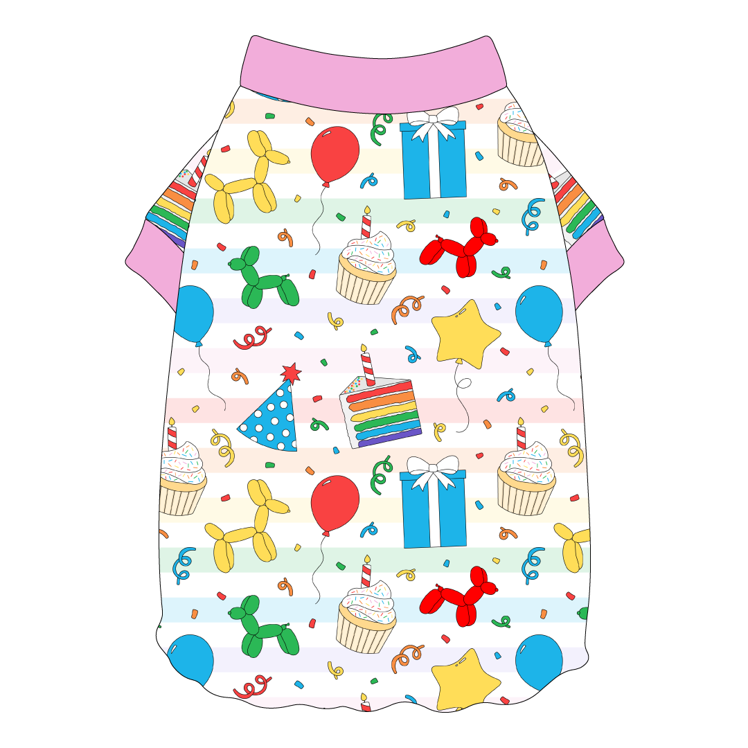 Tee shirt style with flutter hem in a dog friendly pattern that shows party images like balloons, cake, gifts, party hats and more. It's complete with solid pink trim on the neck and sleeves.