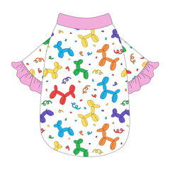 Tee style in a dog friendly pattern that shows party images like balloons and confetti. It's complete with solid pink ruffles on the sleeve edges, as well as trim on the neck and waist.