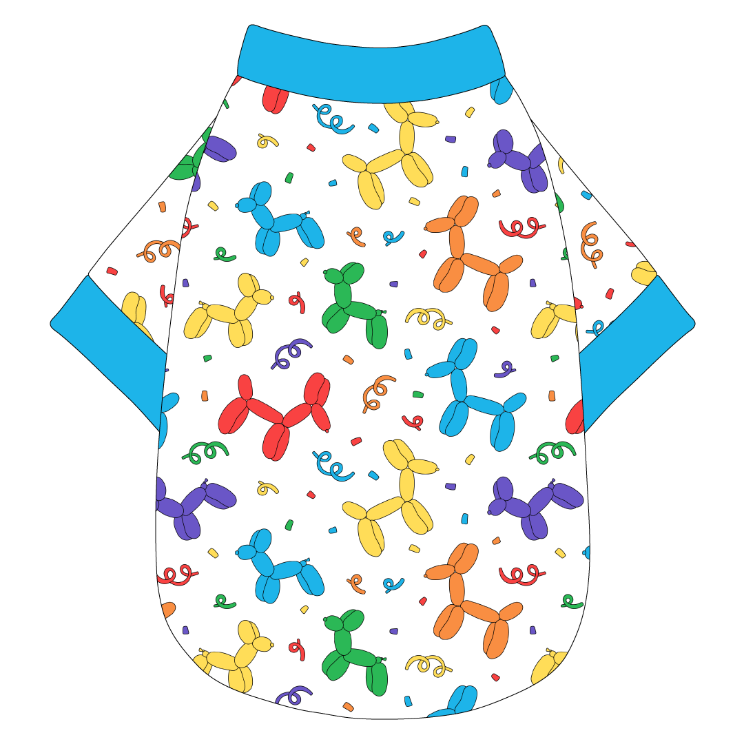 Tee shirt in a dog friendly pattern that shows party images like balloons and confetti. It's complete with solid blue trim on the neck, waist and sleeves.