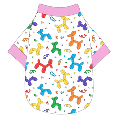 Tee shirt in a dog friendly pattern that shows party images like balloons and confetti. It's complete with solid pink trim on the neck, waist and sleeves.