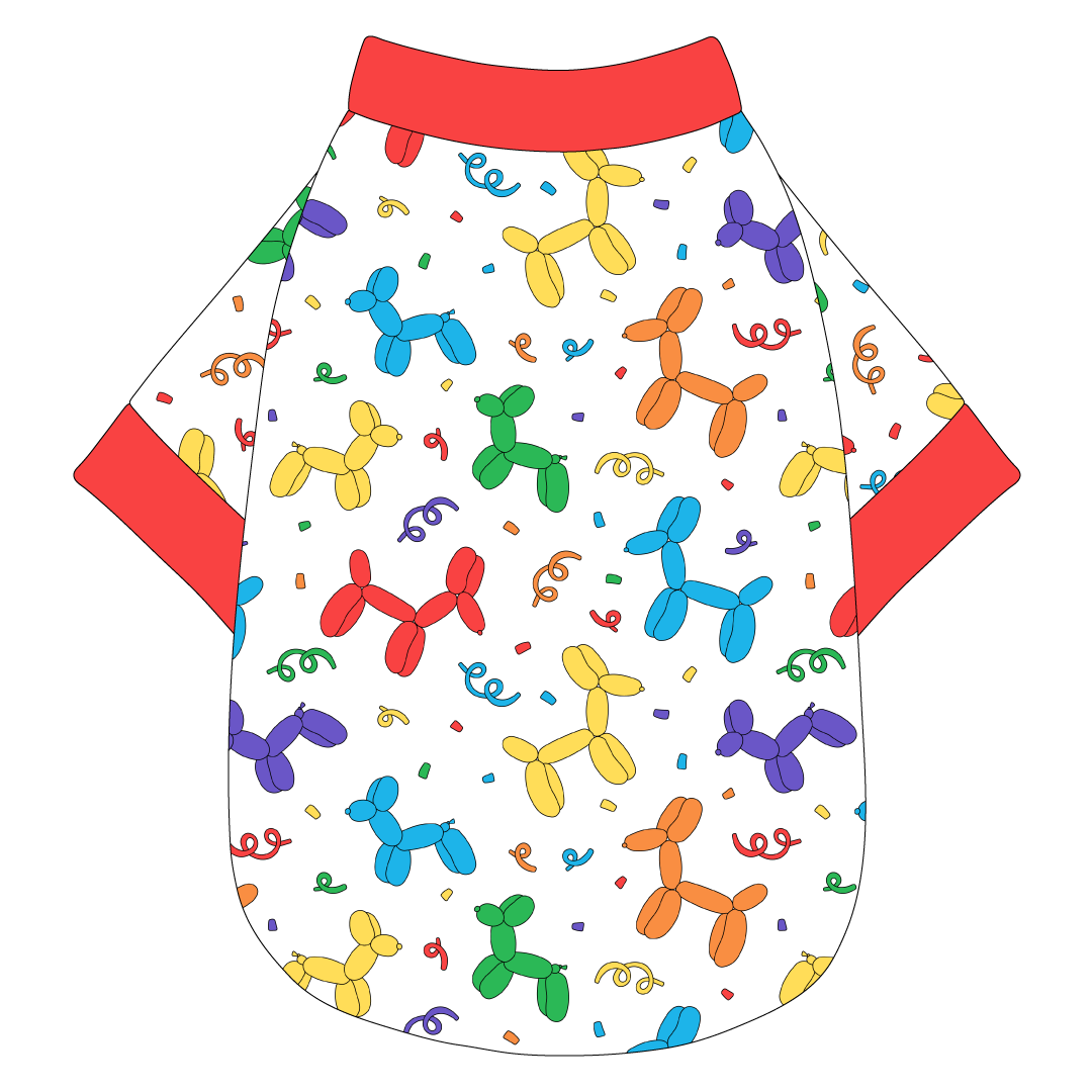 Tee shirt in a dog friendly pattern that shows party images like balloons and confetti. It's complete with solid red trim on the neck, waist and sleeves.