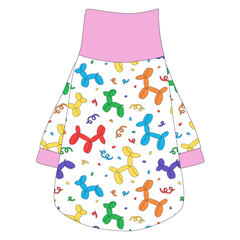 Tee shirt with turtleneck in a dog friendly pattern that shows party images like balloons and confetti. It's complete with solid pink trim on the neck, sleeves and waist.