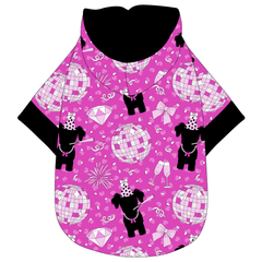 Hoodie in a dog friendly pattern that shows a girl dog with hat and necklace, along with a mirror ball, champagne glasses, fireworks and confetti on a magenta cheetah print background. It's complete with a hood lined in solid black. Black trim is also on the waist and sleeves.