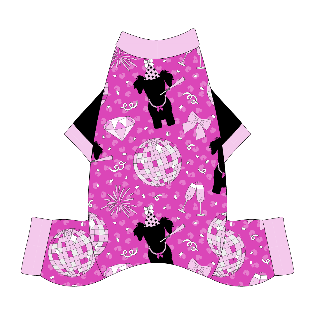 Comfy Christmas Pajamas with solid black sleeves and a dog friendly pattern that shows a girl dog with hat and necklace, along with a mirror ball, champagne glasses, fireworks and confetti on a magenta cheetah print background. It's complete with light pink trim on the neck, sleeves and waist.