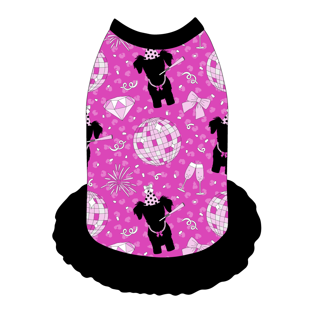 Dress style tank with a girly ruffle skirt in a dog friendly pattern that shows a girl dog with hat and necklace, along with a mirror ball, champagne glasses, fireworks and confetti on a magenta cheetah print background. It's complete with black trim on the neck, shoulders and ruffles.