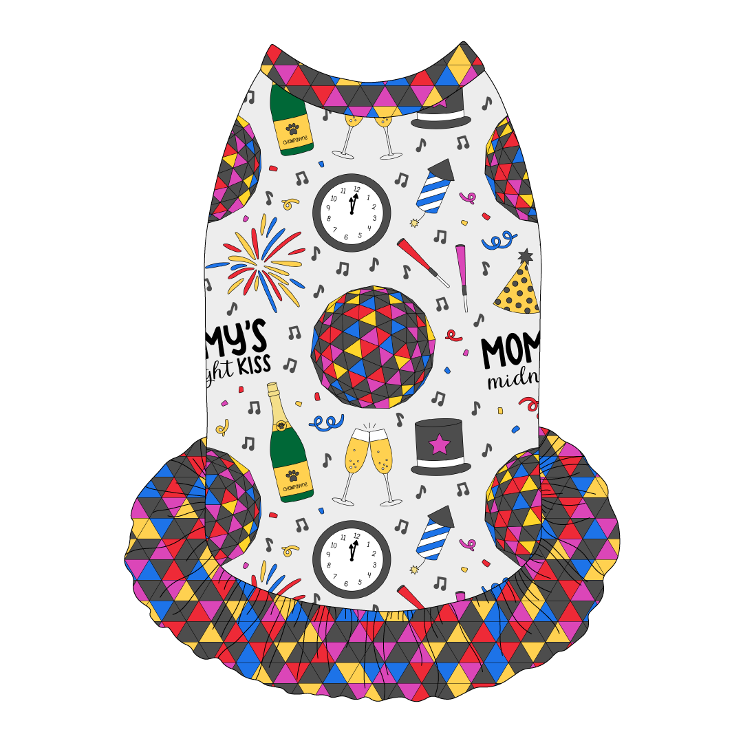 Dress style tank with a girly ruffle skirt in a dog friendly pattern that shows a multi-colored New Years ball, the words Mommy's Midnight Kiss, a clock, champagne bottle and champagne toast, fireworks, confetti and more on a white background.  It's complete with NYE Ball trim on the neck, shoulders and ruffles.