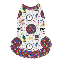 Dress style tank with a girly ruffle skirt in a dog friendly pattern that shows a multi-colored New Years ball, the words Mommy's Midnight Kiss, a clock, champagne bottle and champagne toast, fireworks, confetti and more on a white background.  It's complete with NYE Ball trim on the neck, shoulders and ruffles.