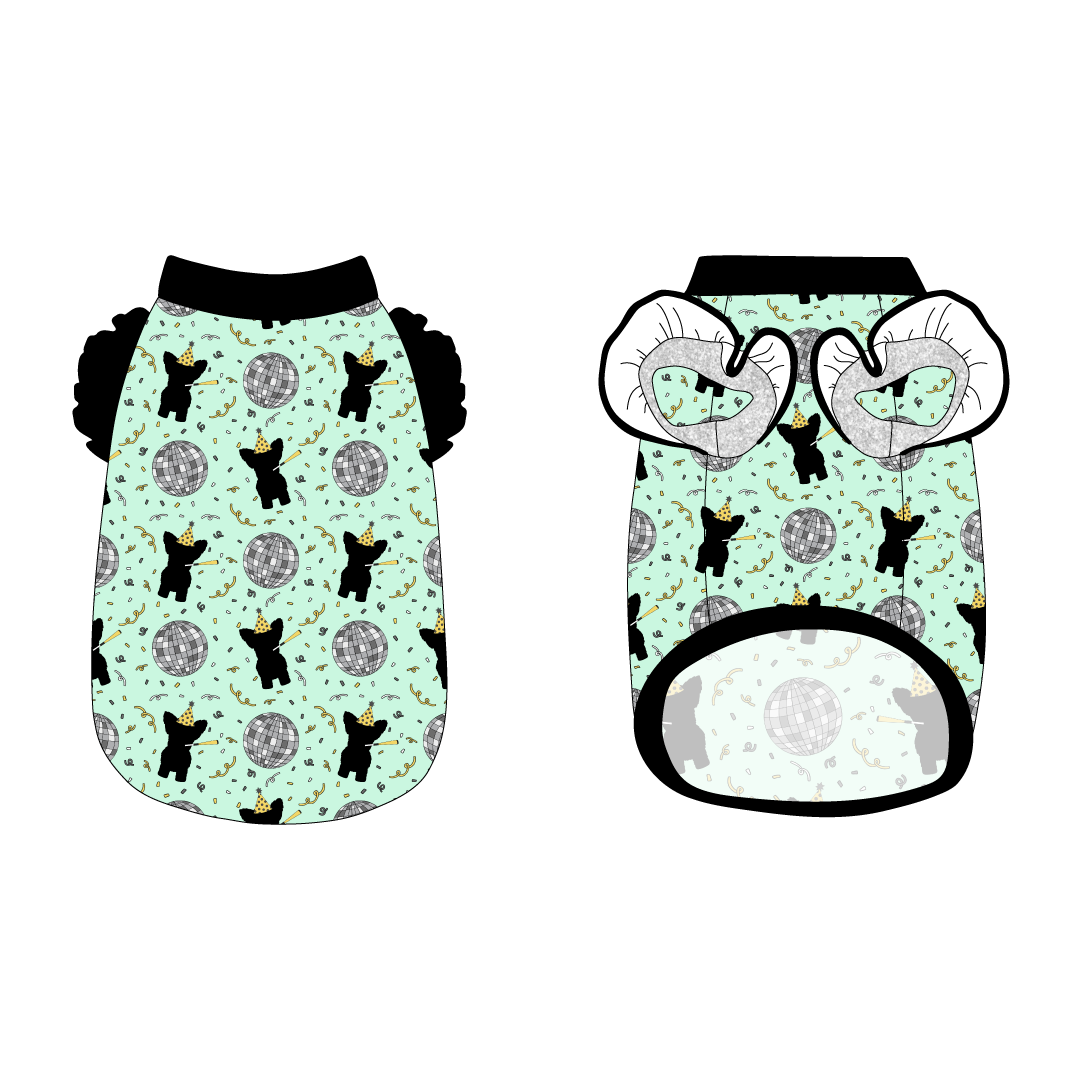 Tank with ruffle accents on the shoulders in a dog friendly pattern that shows a mirror ball, dog with a party blower and confetti on a light green background.  It's complete with black trim on the neck, waist and shoulder ruffles, as well as a coordinating trim under the shoulder ruffles in silver sparkle.