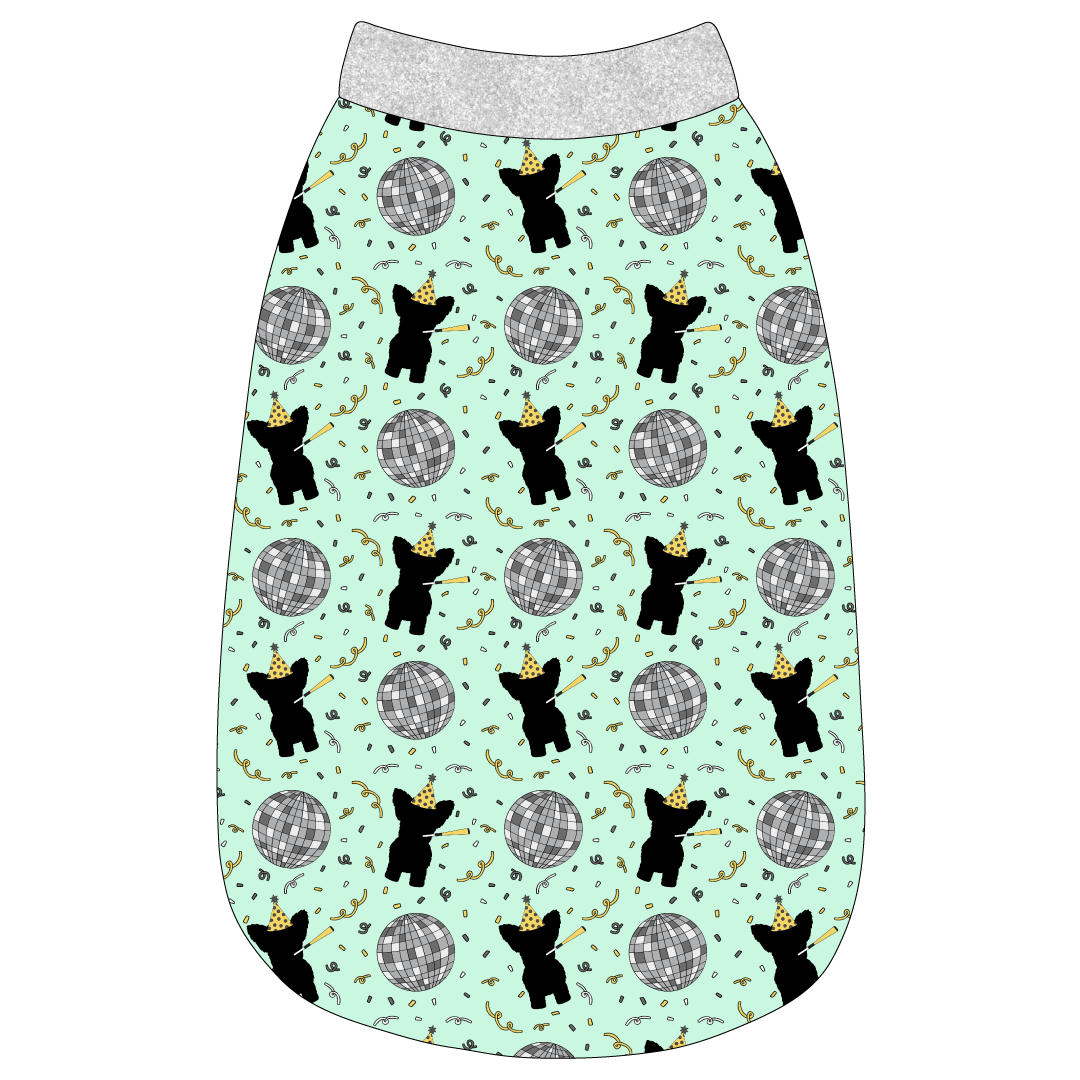 Tank in a dog friendly pattern that shows a mirror ball, dog with a party blower and confetti on a light green background.  It's complete with silver sparkle trim on the neck, waist and shoulders.