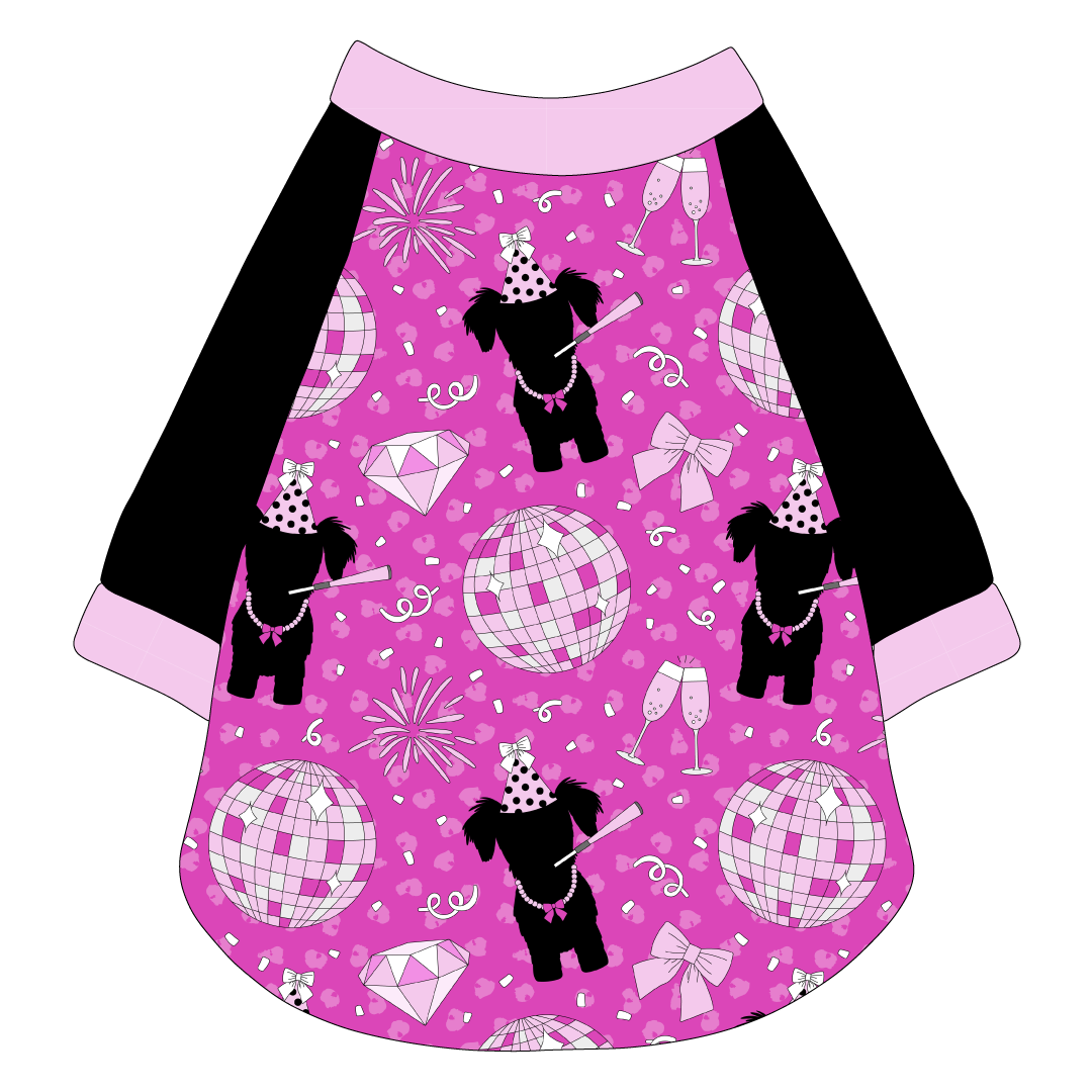 Raglan style tee in a dog friendly pattern that shows a girl dog with hat and necklace, along with a mirror ball, champagne glasses, fireworks and confetti on a magenta cheetah print background. It's complete with solid black sleeves and trimmed in light pink. Light pink trim is also on the neck and waist.