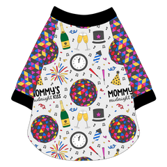 Raglan style tee in a dog friendly pattern that shows a multi-colored New Years ball, the words Mommy's Midnight Kiss, a clock, champagne bottle and champagne toast, fireworks, confetti and more on a white background.  It's complete with NYE Ball sleeves and trimmed in black. Black trim is also on the neck and waist.