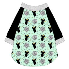 Raglan style tee in a dog friendly pattern that shows a mirror ball, dog with a party blower and confetti on a light green background.  It's complete with black sleeves and trimmed in silver sparkle. Silver sparkle trim is also on the neck and waist.