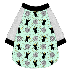 Raglan style tee in a dog friendly pattern that shows a mirror ball, dog with a party blower and confetti on a light green background.  It's complete with silver sparkle sleeves and trimmed in black. Black trim is also on the neck and waist.