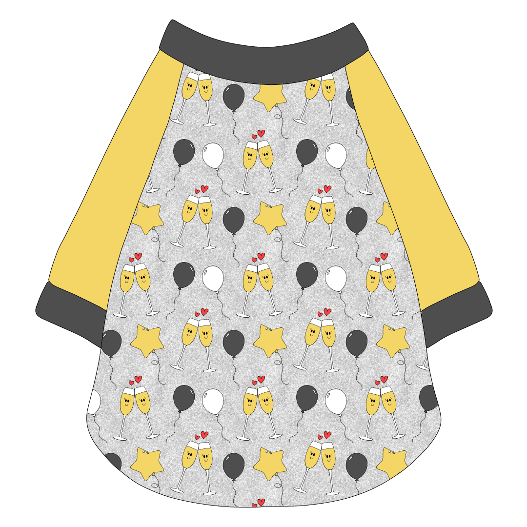 Raglan style tee in a dog friendly pattern that shows two happy champagne glasses making a toast with hearts overhead, gold star balloons and traditional balloons in white and gray on a silver sparkle background.  It's complete with gold sleeves and trimmed in gray. Gray trim is also on the neck and waist.