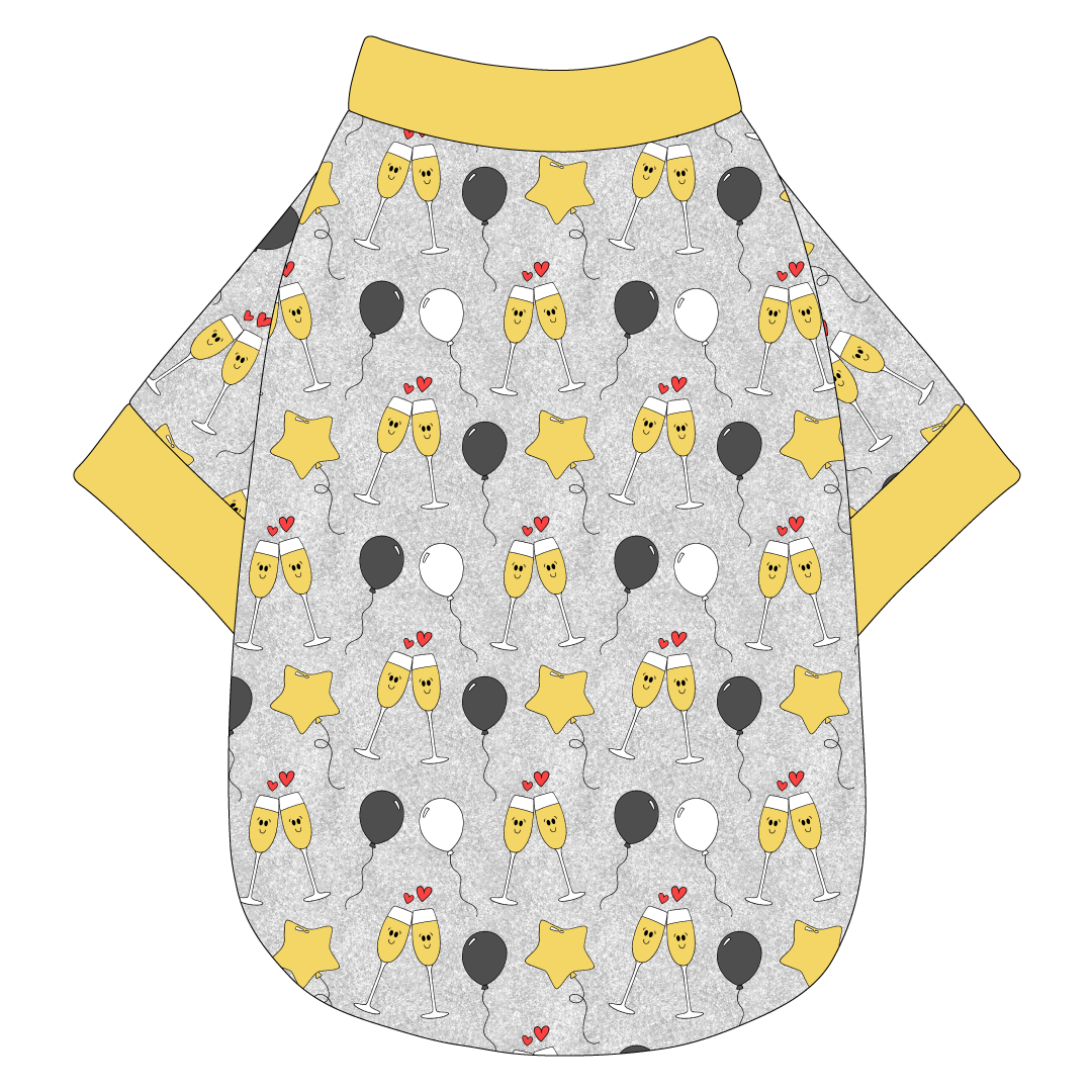 Tee shirt in a dog friendly pattern that shows two happy champagne glasses making a toast with hearts overhead, gold star balloons and traditional balloons in white and gray on a silver sparkle background.  It's complete with gold trim on the neck, waist and sleeves