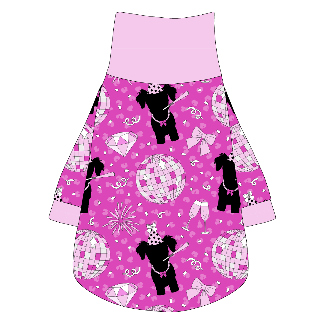 Tee shirt with turtleneck in a dog friendly pattern that shows a girl dog with hat and necklace, along with a mirror ball, champagne glasses, fireworks and confetti on a magenta cheetah print background. It's complete with light pink trim on the neck, sleeves and waist.